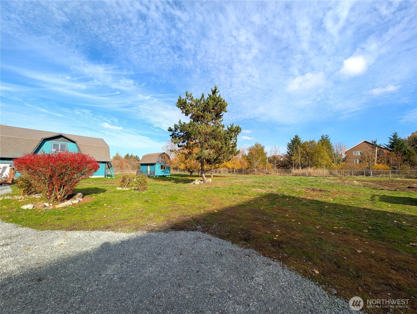Looking from the back of the driveway towards the detached garage & storage shed.
