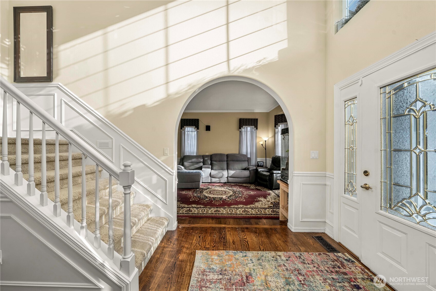 The elegance of wainscoting, arched entryways and beautiful hardwoods carry throughout the home.