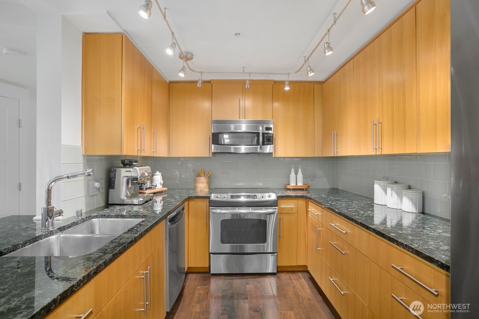 Grand kitchen with cabinets/storage galore.