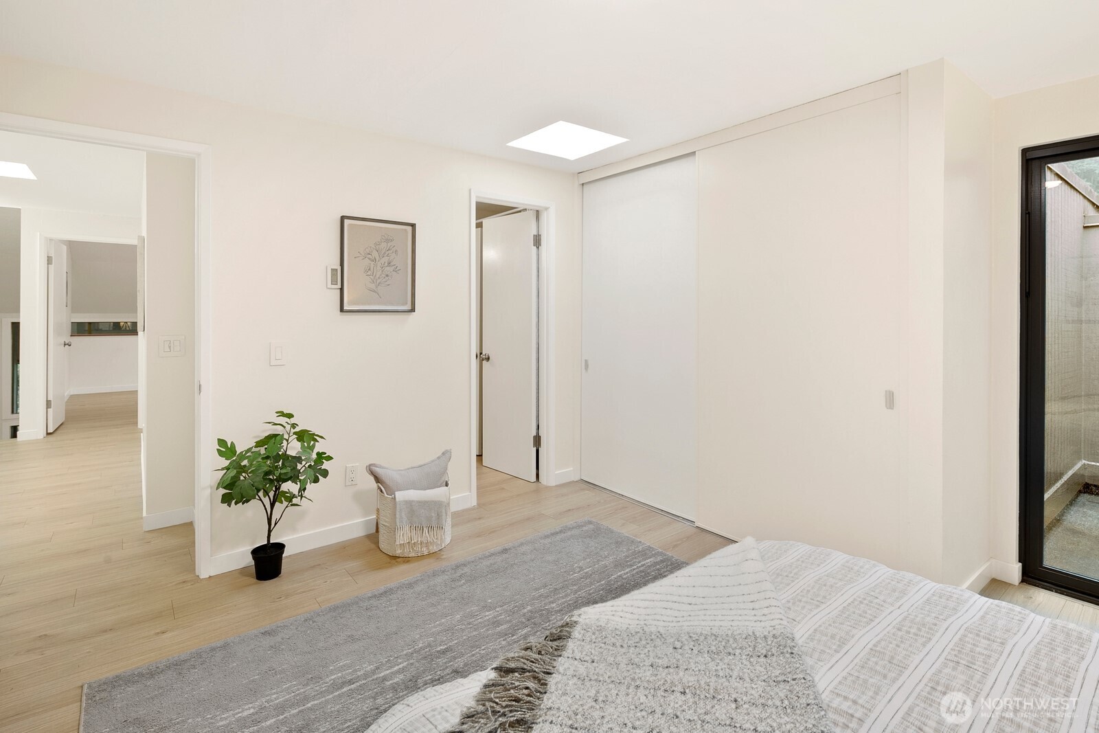 Bedroom #1 on upper level, with extra-large closet and jack-and-jill bathroom access.  Private patio for morning yoga or growing a mini-garden.