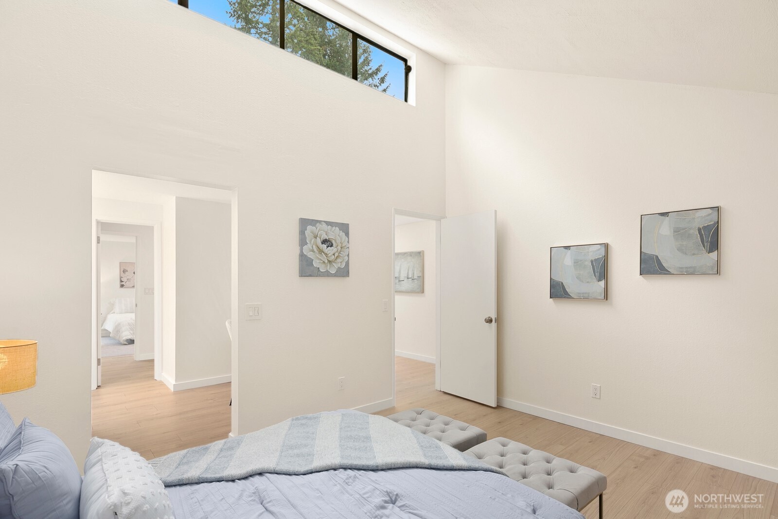 Bedroom #2 features vaulted ceilings and views of the pond.  Shared access to full bathroom.