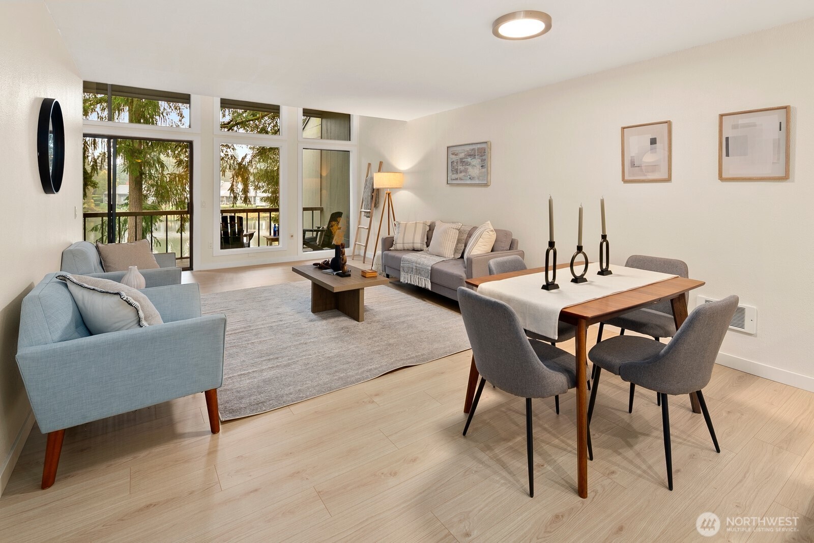 Dining area and living room enjoy a view of the lake.