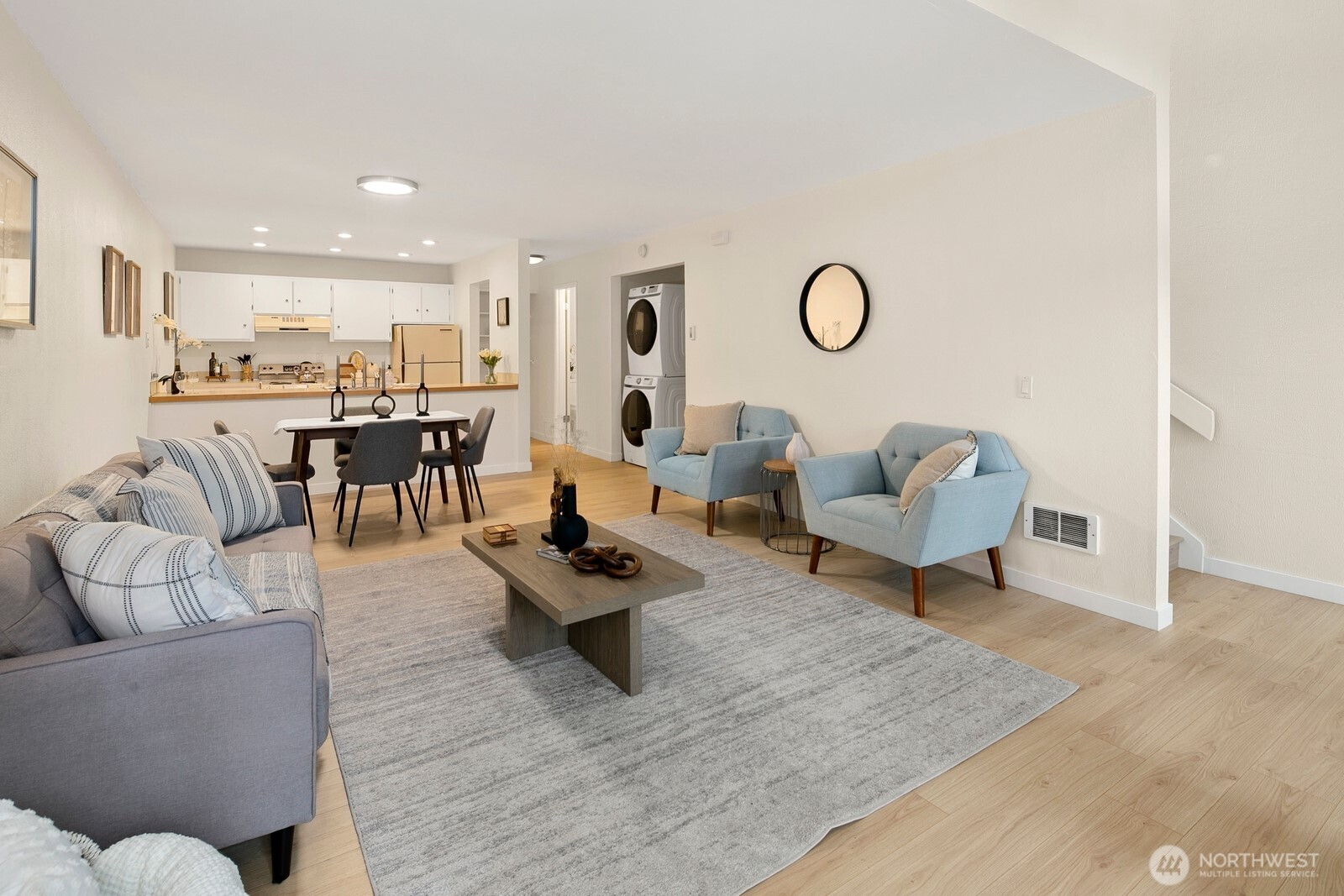 Main living level offers an open floor plan where you can relax, cook, and visit with friends.  Laundry is on this level tucked in a closet under the stairs.  There is also a half-bathroom on this level, and a storage closet in the back.