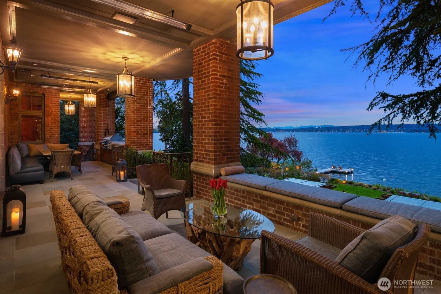 Lovely lower deck with outdoor heaters and a built-in grill sets the stage for beautiful gatherings.