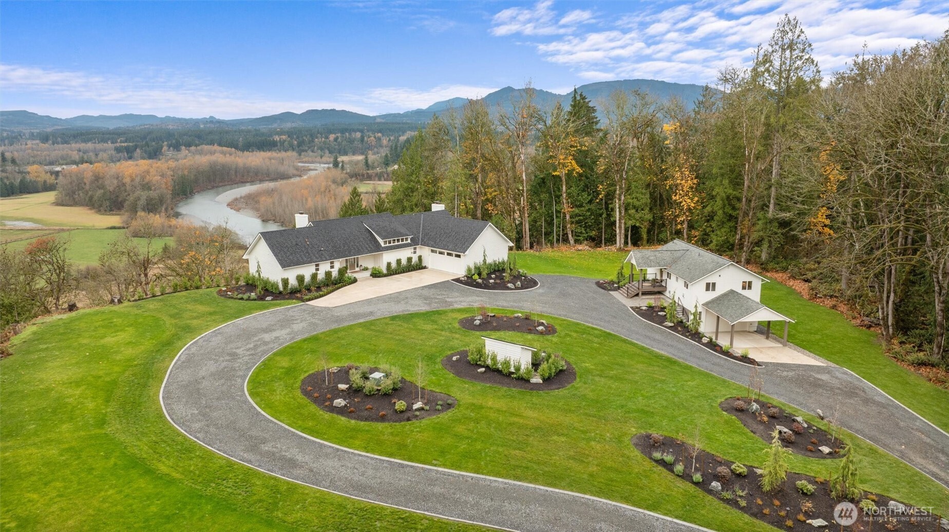 Exquisite French Country-inspired estate encompasses two distinct homes on 18.5 acres with spectacular territorial mountain and river views!