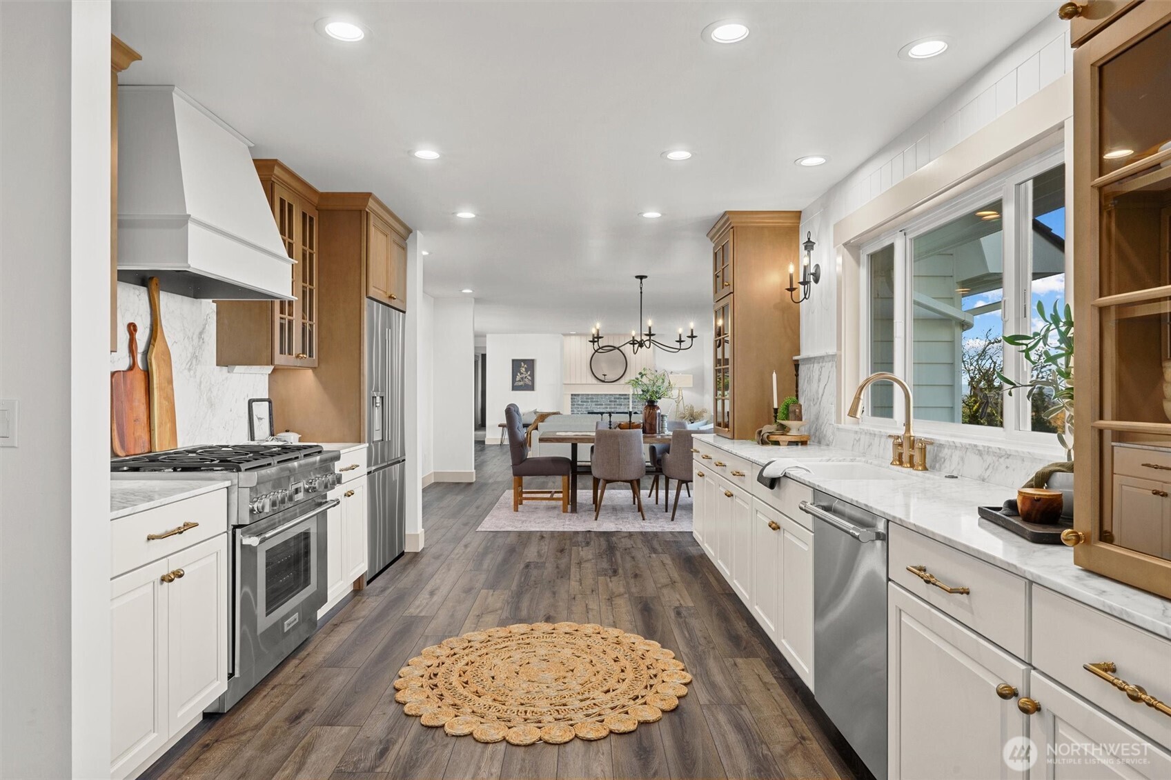 Amazing chef's kitchen, perfect for entertaining family and friends. Custom sideboard by entry (stays with home) was designed to be multifunctional and can be used as a moveable island, if desired.