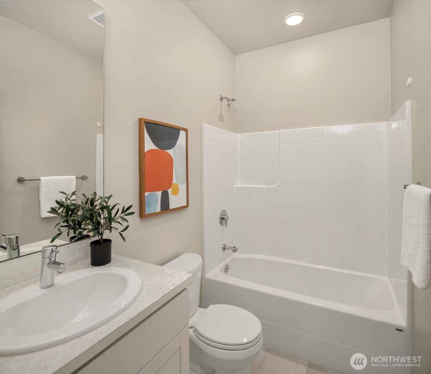 Ground level full bath as part of guest suite.