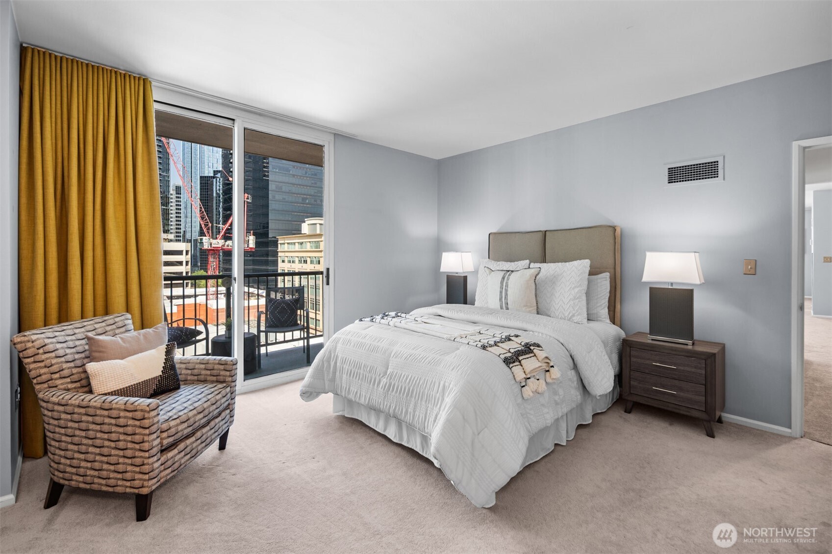 he spacious primary bedroom provides a serene retreat with stunning views of the city. A true sanctuary in the heart of downtown Bellevue.