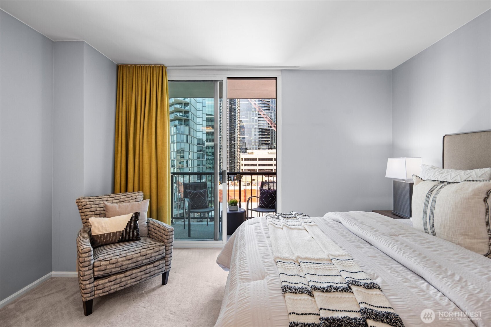 The well-appointed primary suite offers a large, private space with customized closet designs for optimal organization.