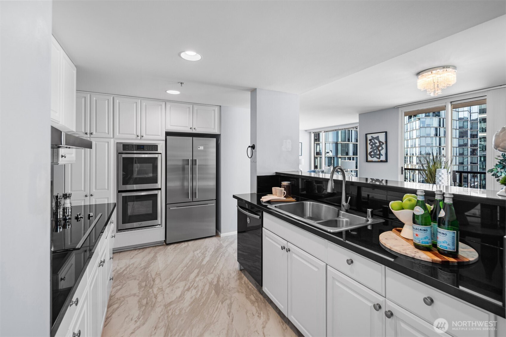 Modern kitchen with black granite countertops and newer appliances
