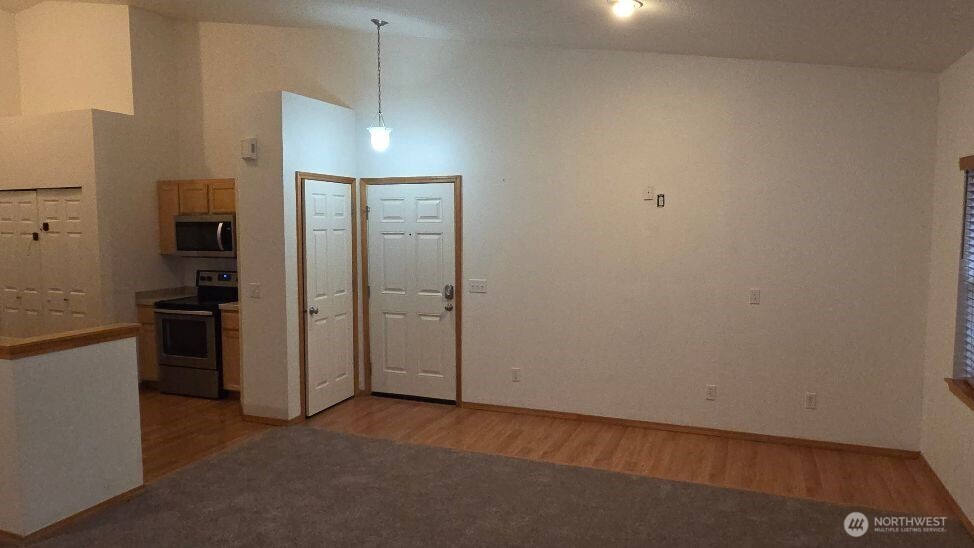 Entry area Owner had a free standing Elect. Fireplace and BIG Screen area