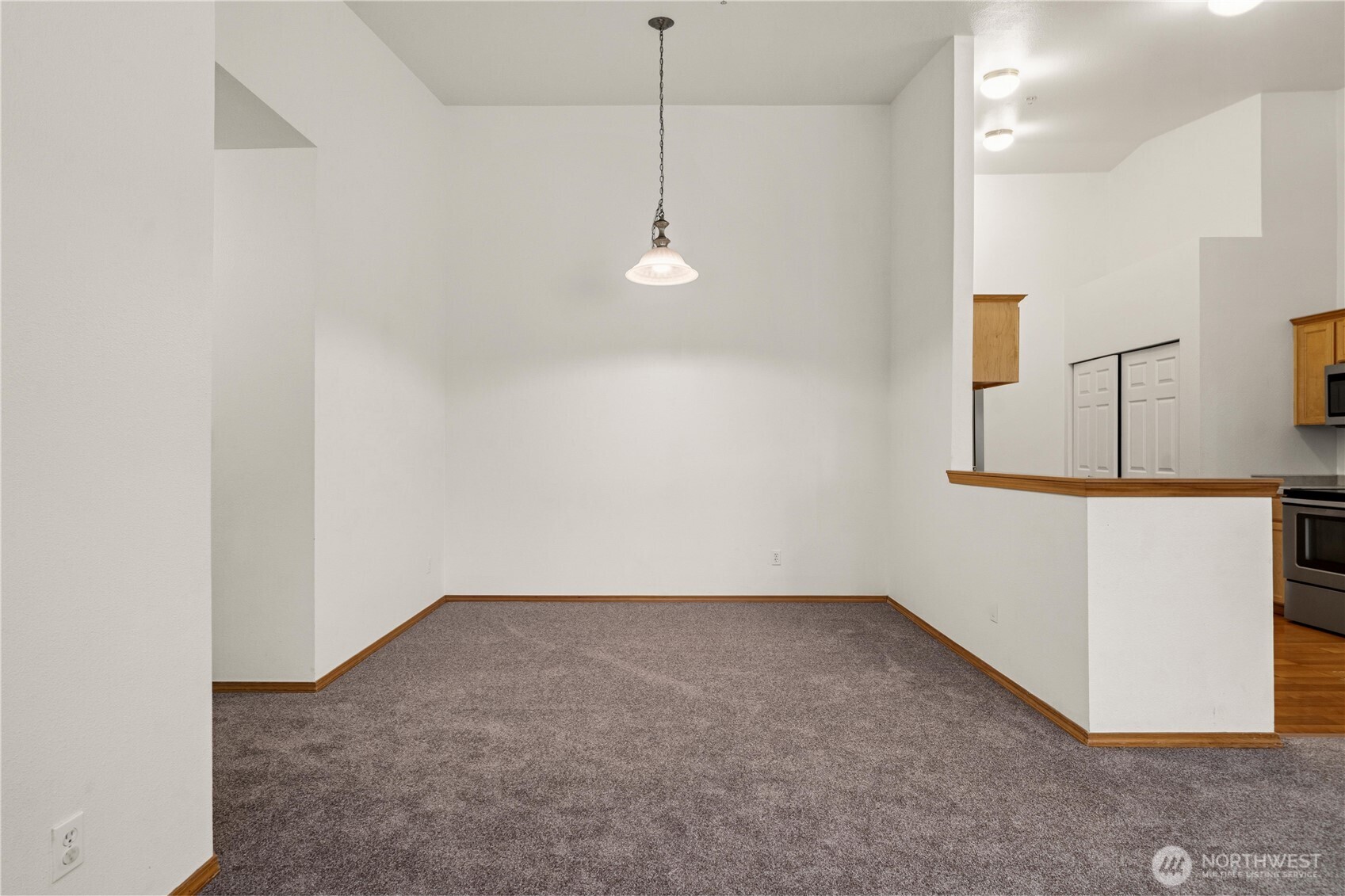 Dining room, hallway on the left.  Big Vaulted Ceilings, kitchen to the right