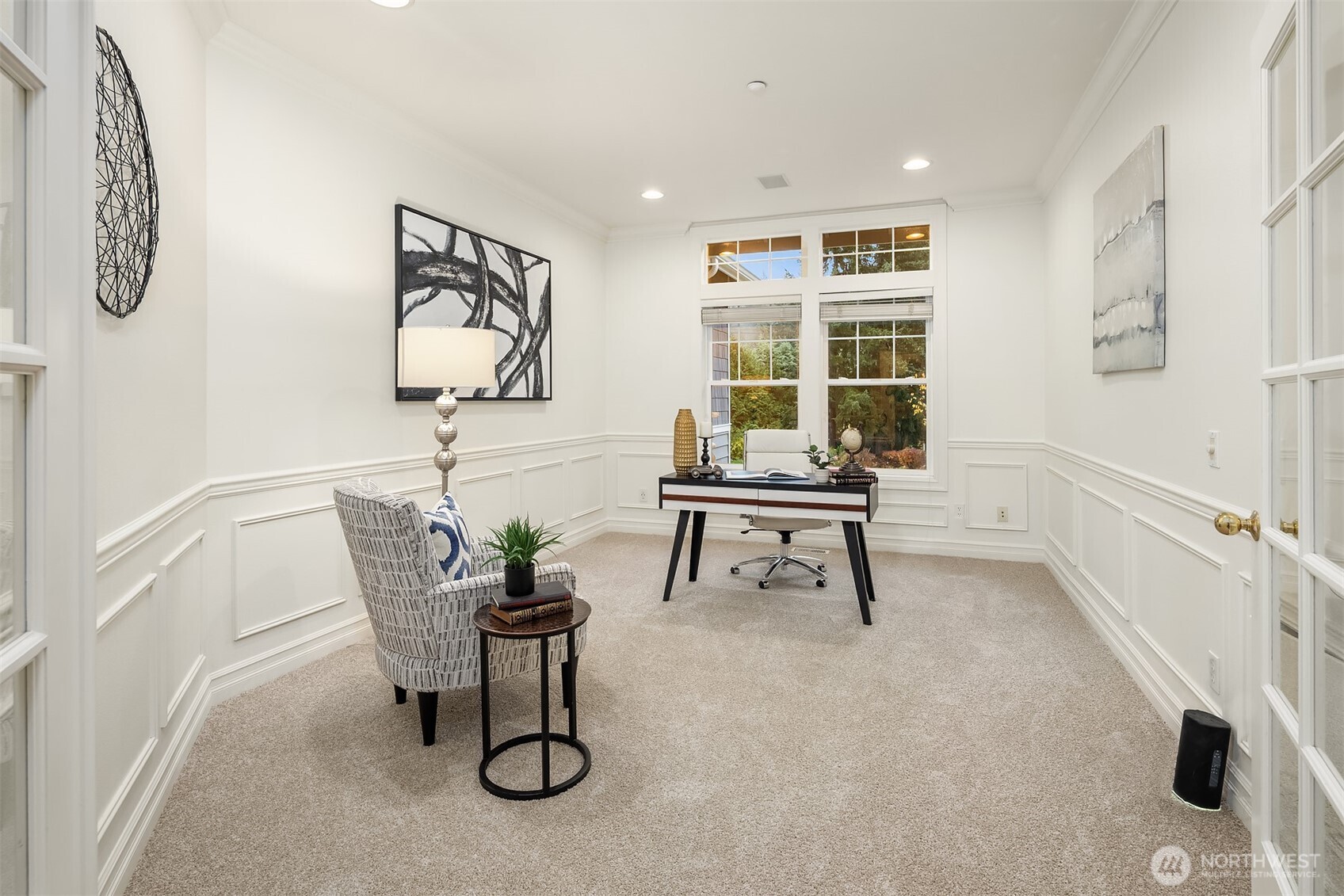 Formal dining off the formal living room, separated by elegant french doors.