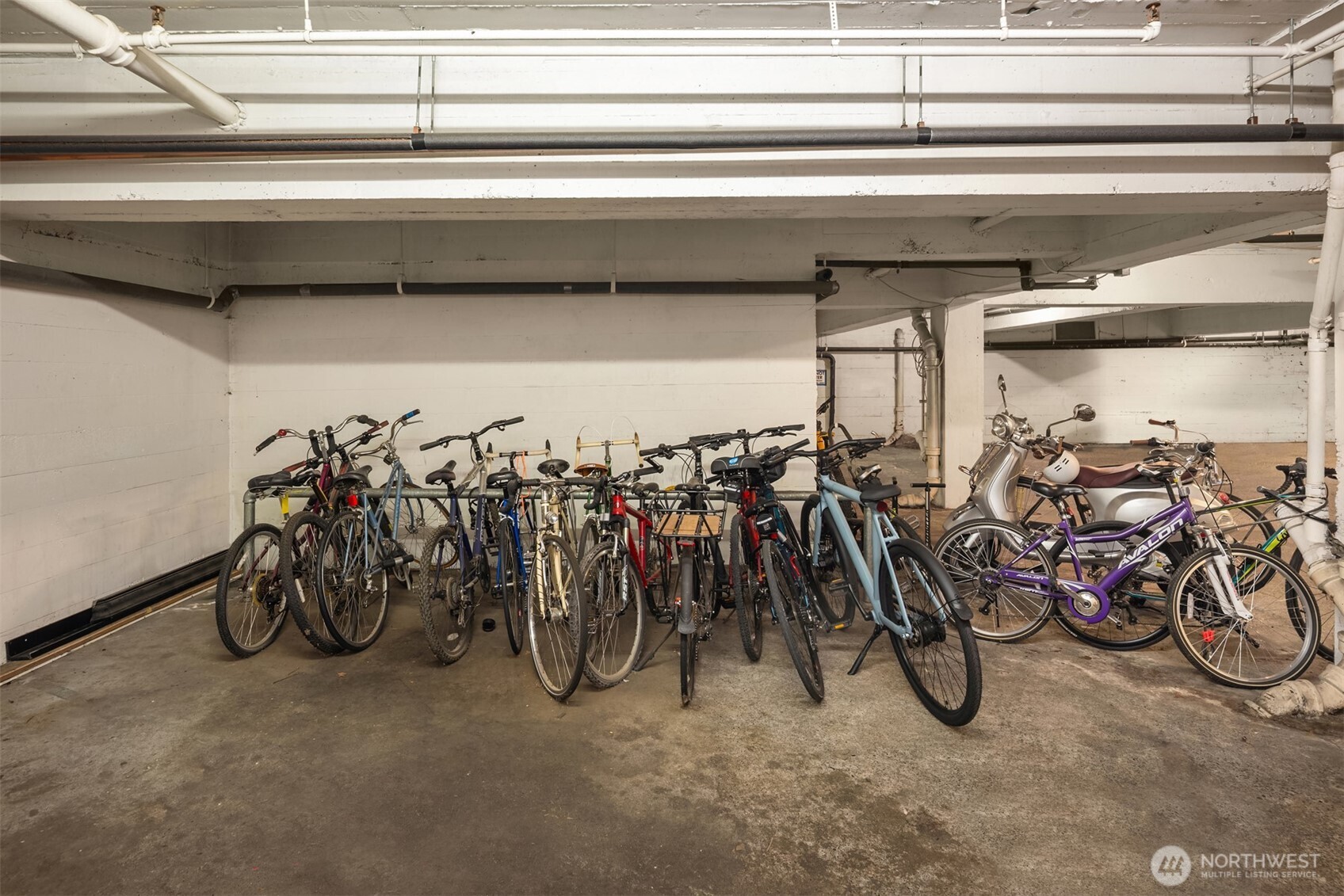 Community bike storage located in garage.