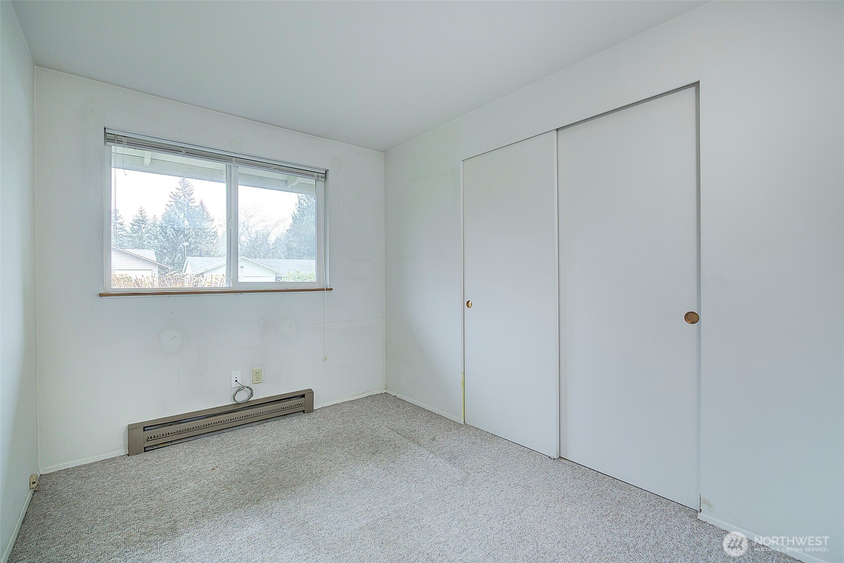 Bedroom #3 looks out to the front yard.