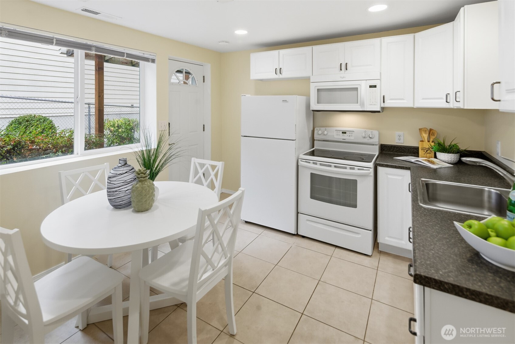 Beautiful kitchen in the basement apartment. Exterior access door to right of window.