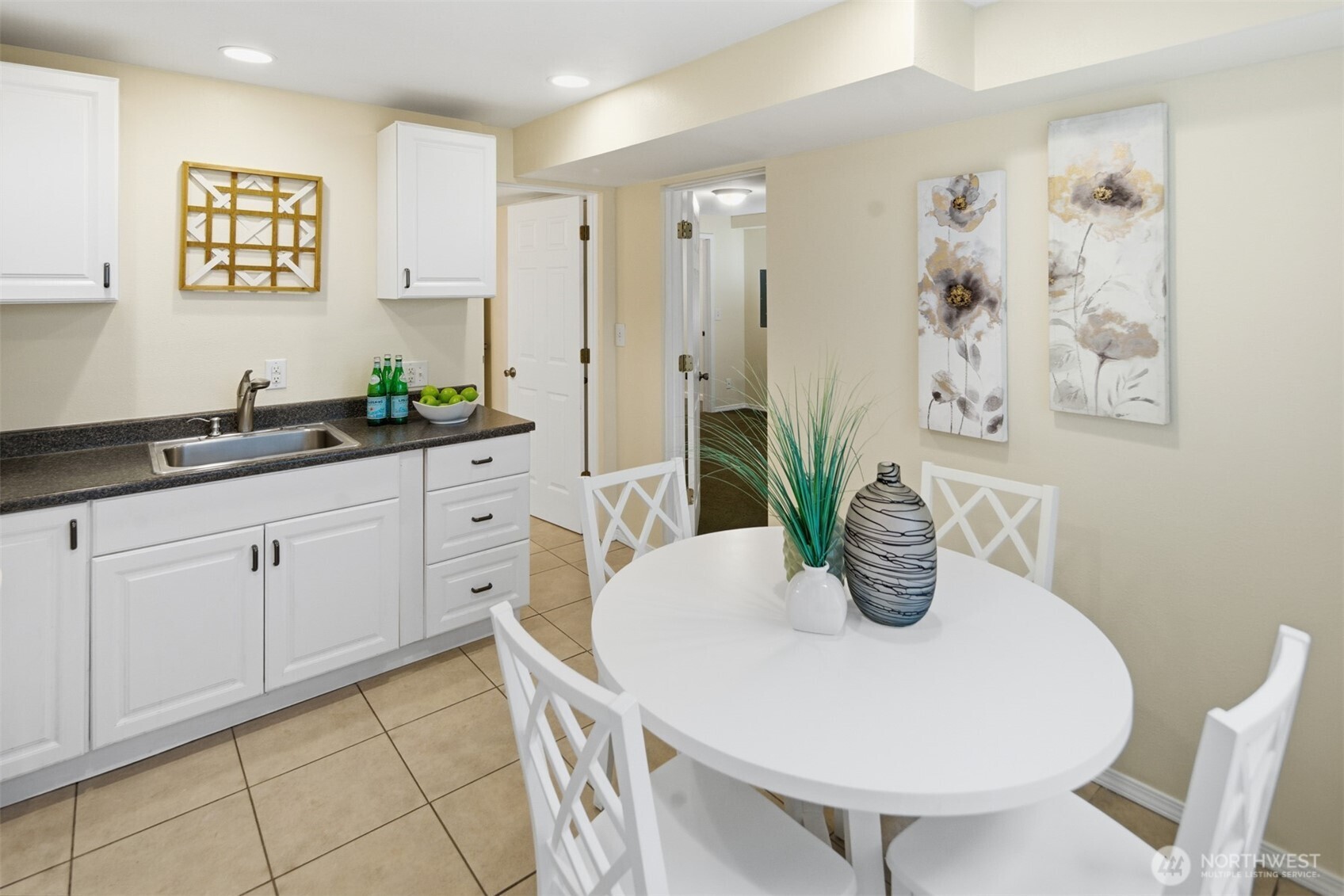 Apartment eat in kitchen with doors to the full bathroom and bedroom.