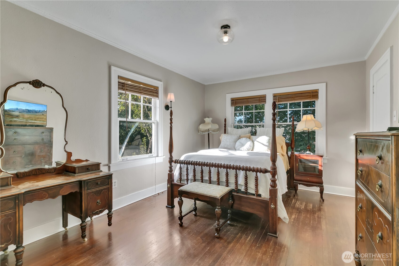 Main-level bedroom tucked privately in the corner of the home.