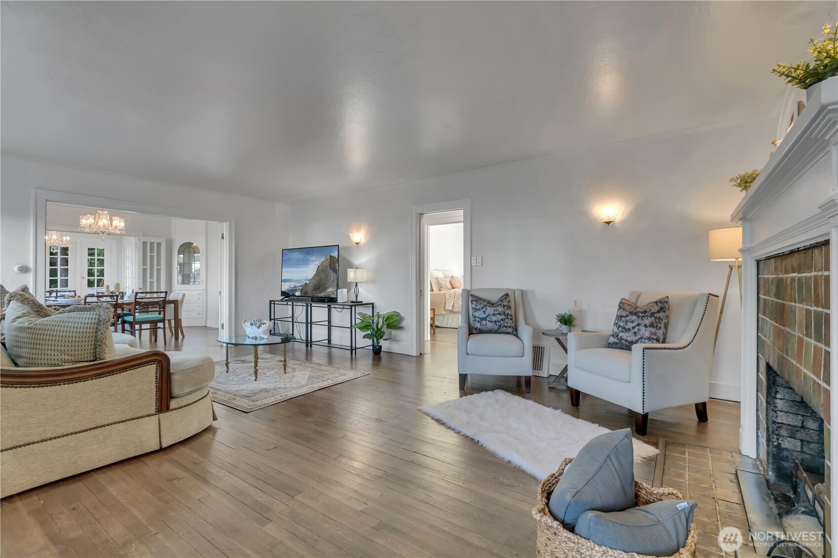 Upon entering, you’ll immediately notice how the open living spaces flow seamlessly from the living room to the dining area and sunroom.