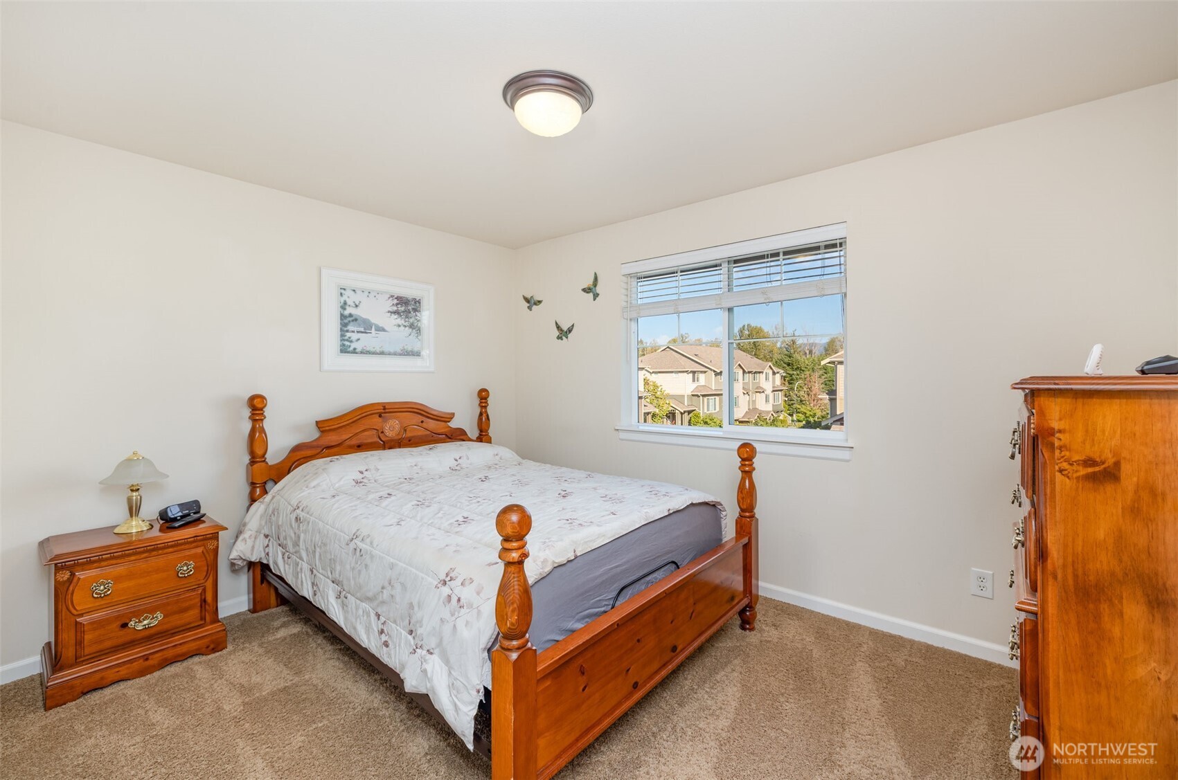 Second upstairs guest bedroom also has a large sliding door closet.
