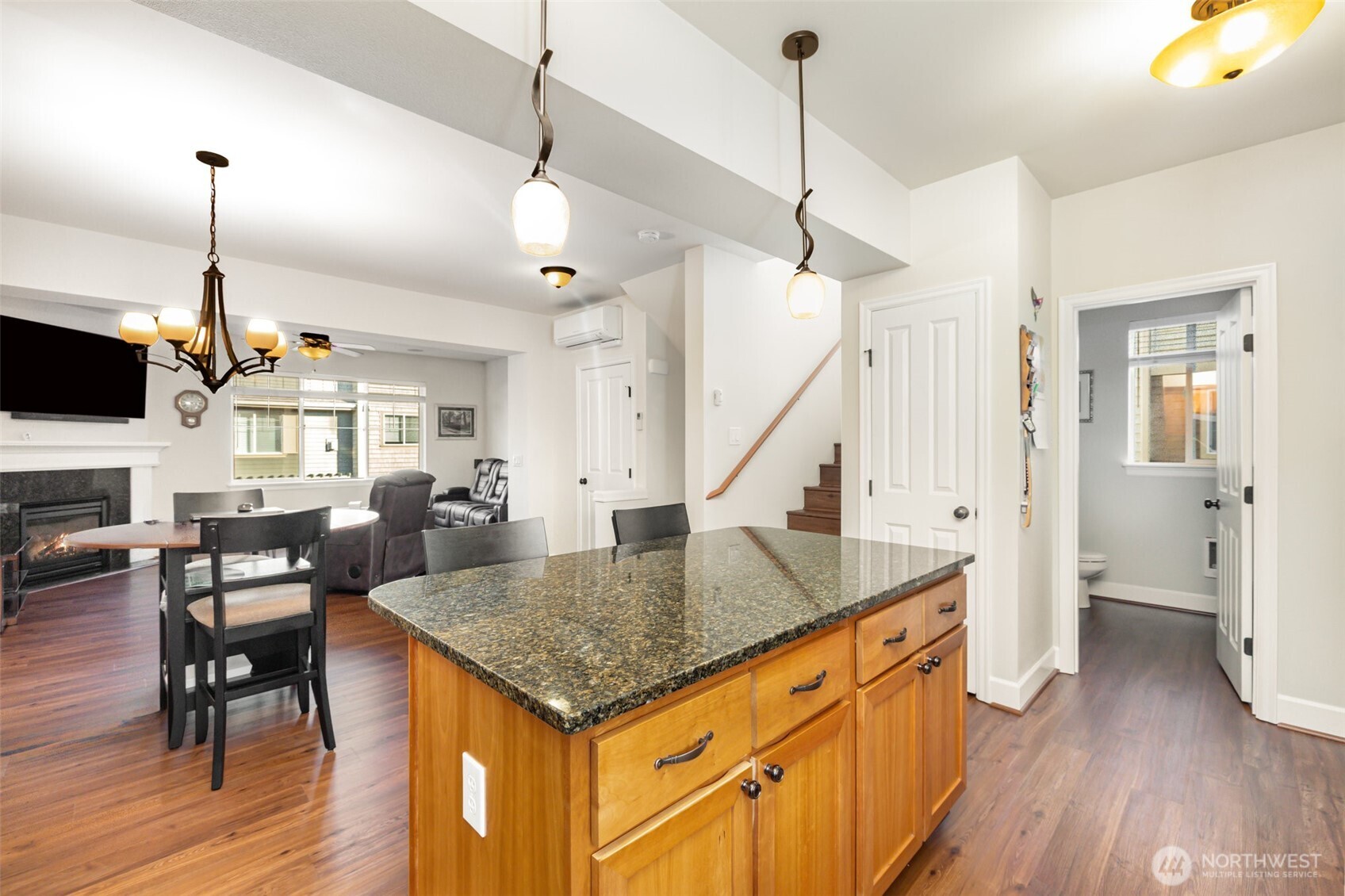 Large island adds extra storage, counter space, and a place for casual meals or morning coffee.