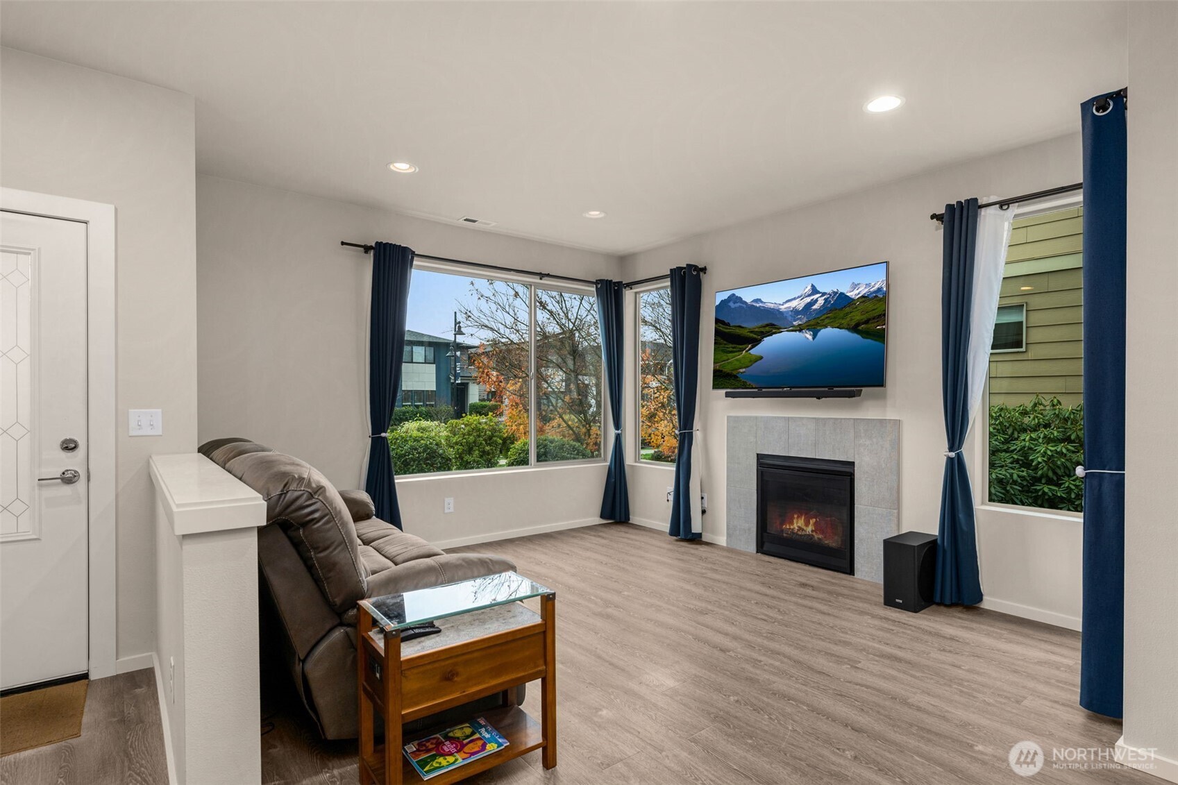Open concept floor plan with tons of natural light and a gas fireplace