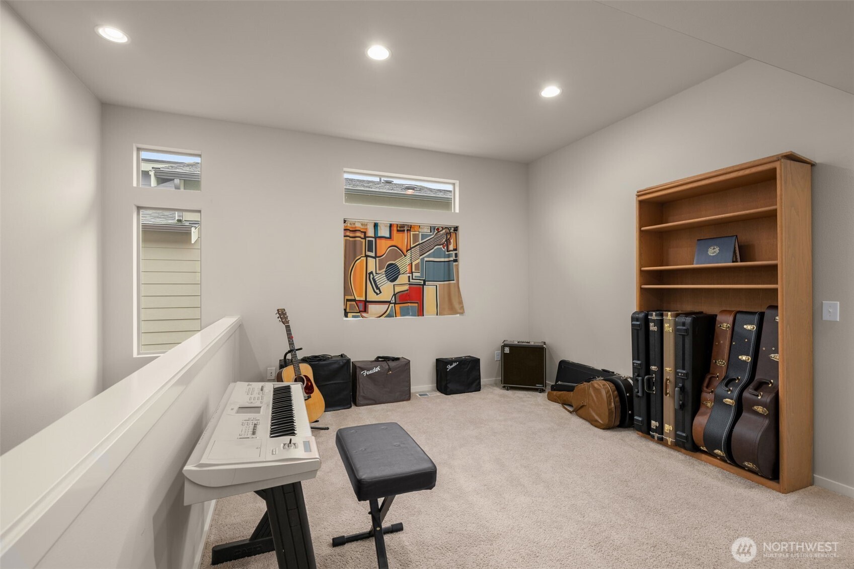 Spacious upstairs loft space currently being utlitized as a music room! Could easily be converted to a 4th bedroom!