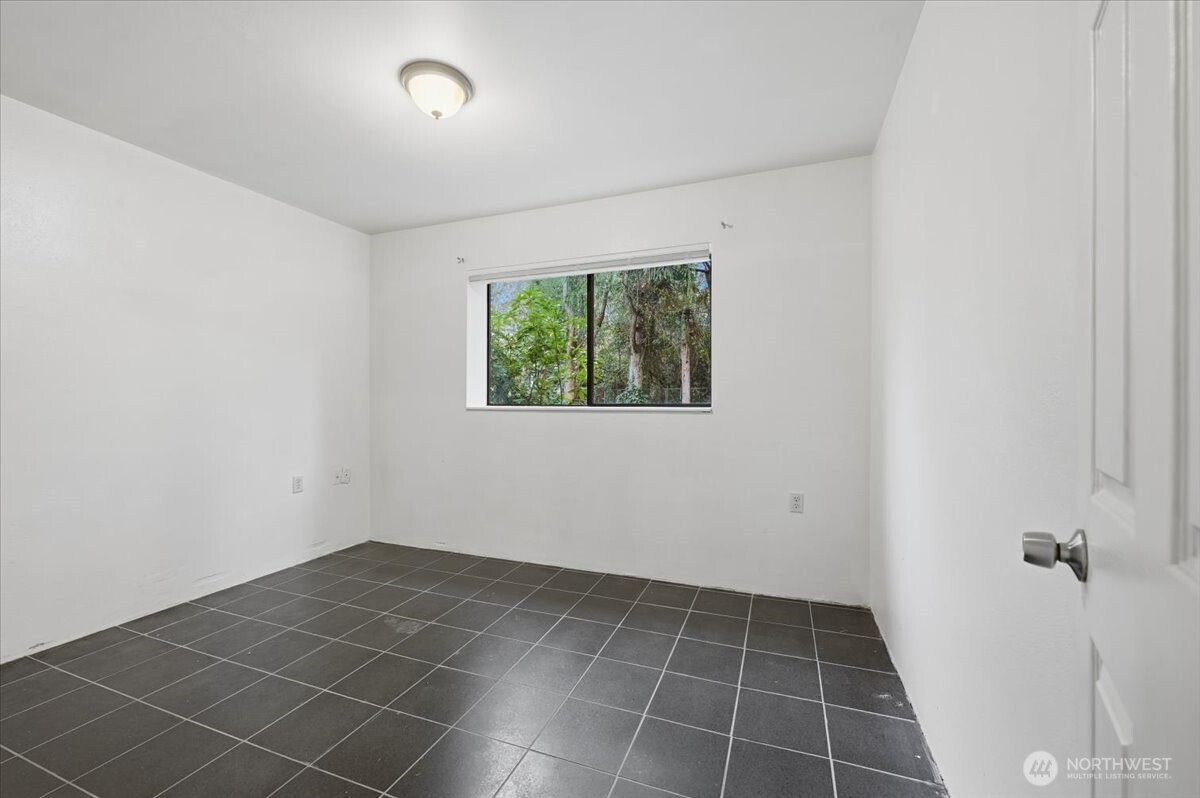 3rd bedroom on lower level with entry to bathroom