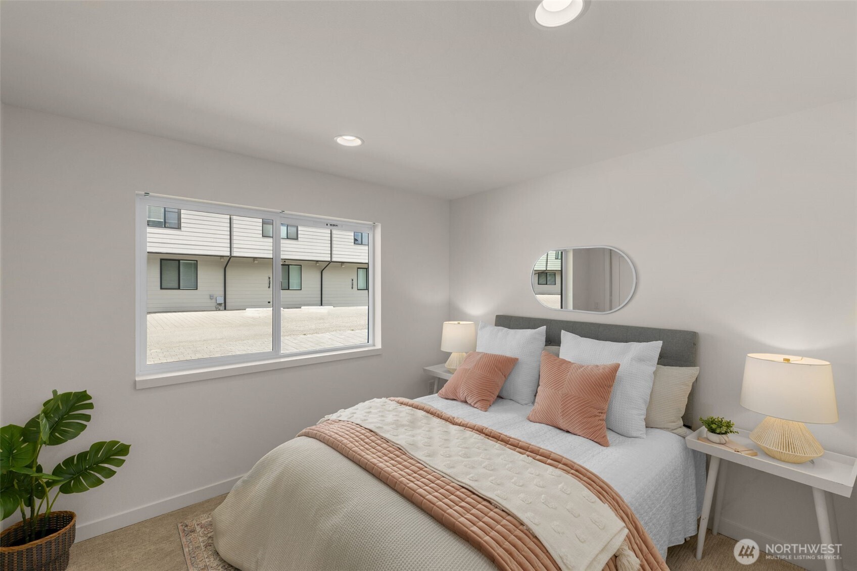 Bright secondary bedroom invites creativity as a serene guest room a personal library or a cozy studio.