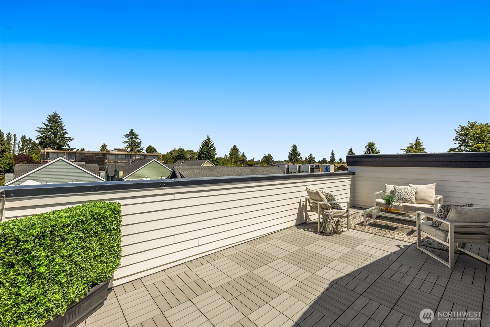 Rooftop retreat offers sweeping treetop and neighborhood views ideal for summer evenings.