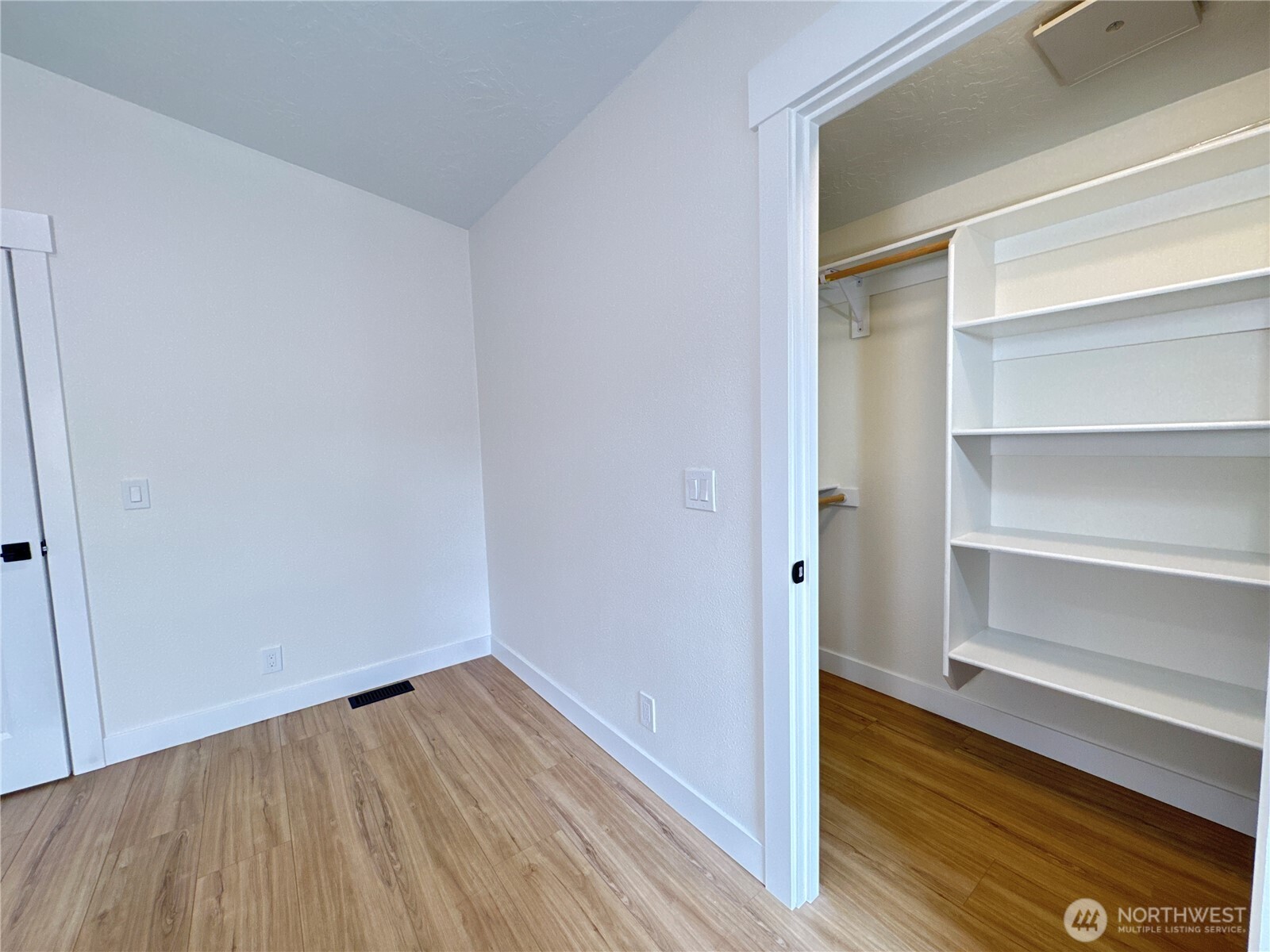 Primary bedroom closet, with brand new closet kit.