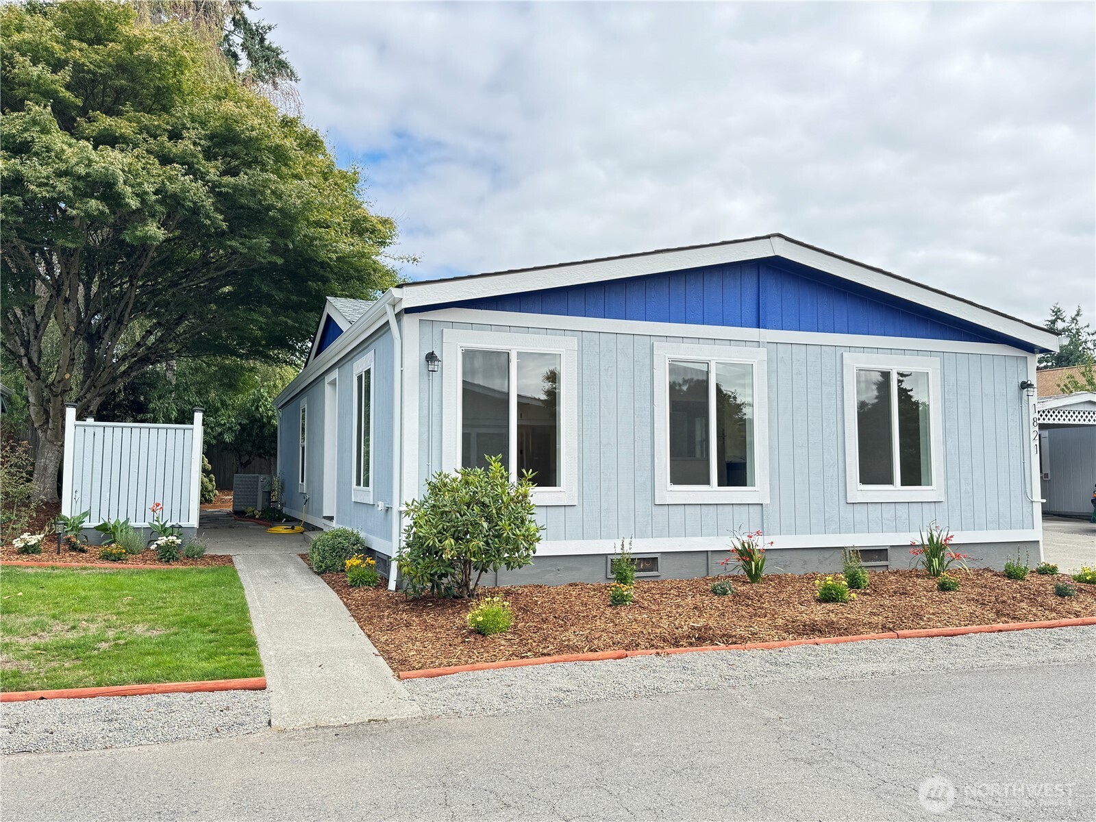 Freshly updated landscaping. Mix of new plants, and mature plants.