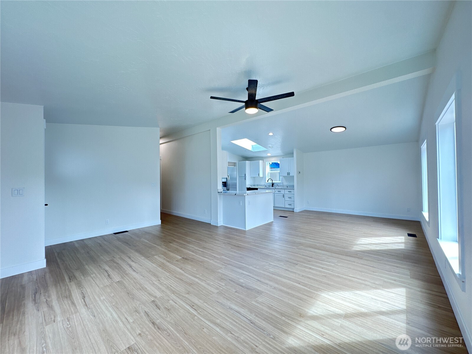 Big open concept living space. The kitchen, dining room, and living room flow together. Large and new south facing windows provide plenty of light!