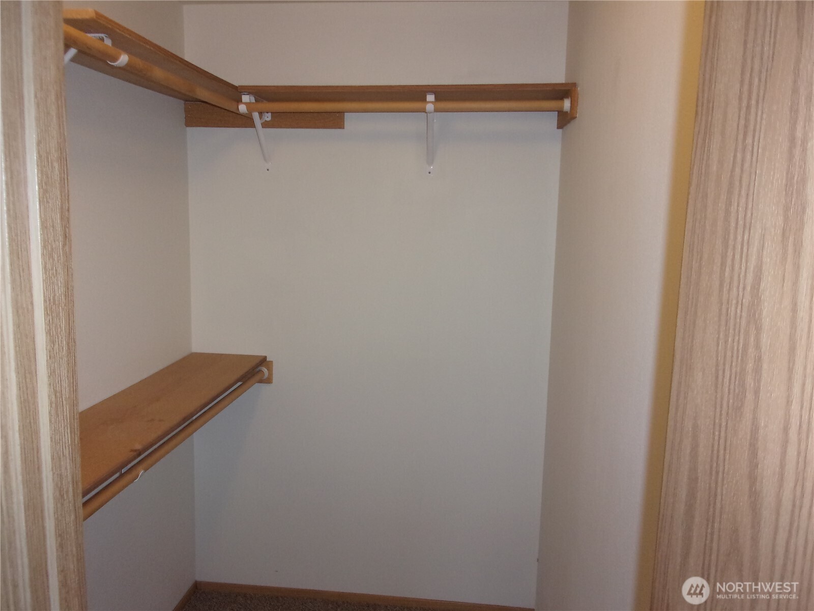 Walk-in closet in primary bedroom.
