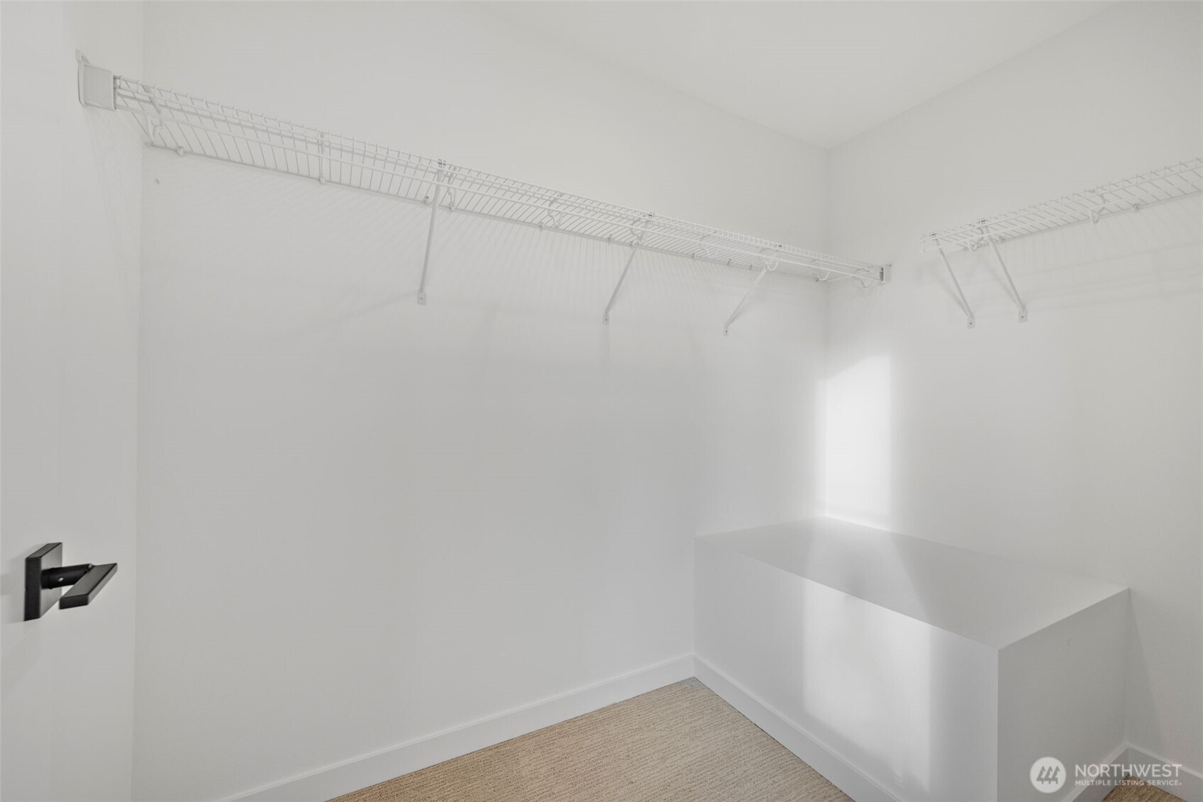 Primary suite walk-in closet.   Photos are of model home of same floorplan. Color schemes will vary.