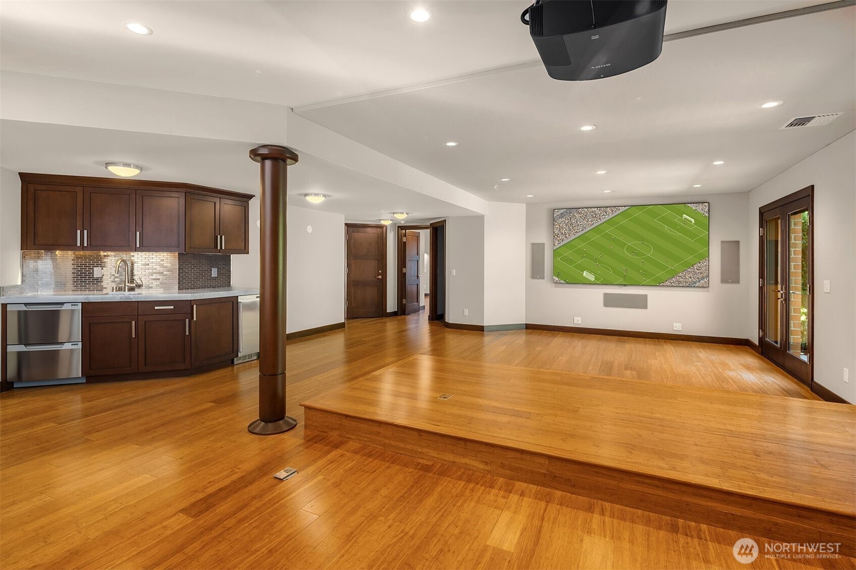 Lower level great room with built in movie theatre and raised seating