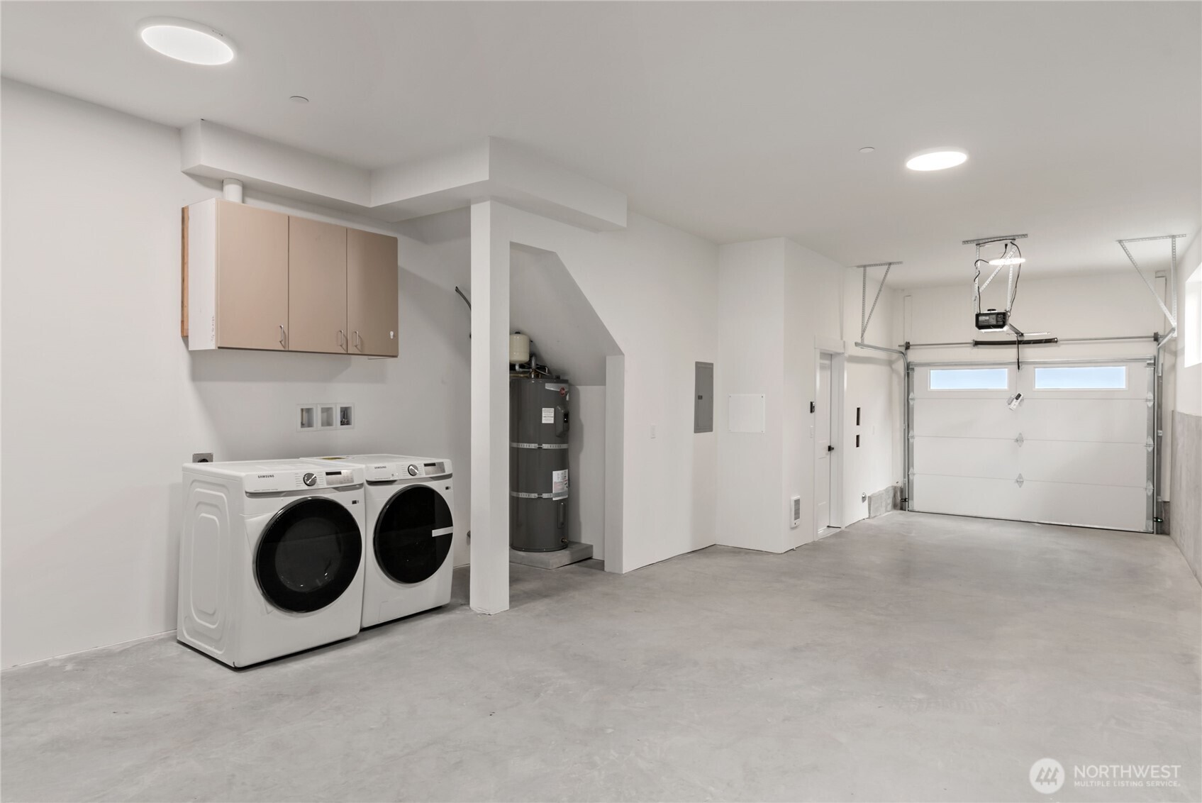 Utility room in spacious 2 car garage tandum
