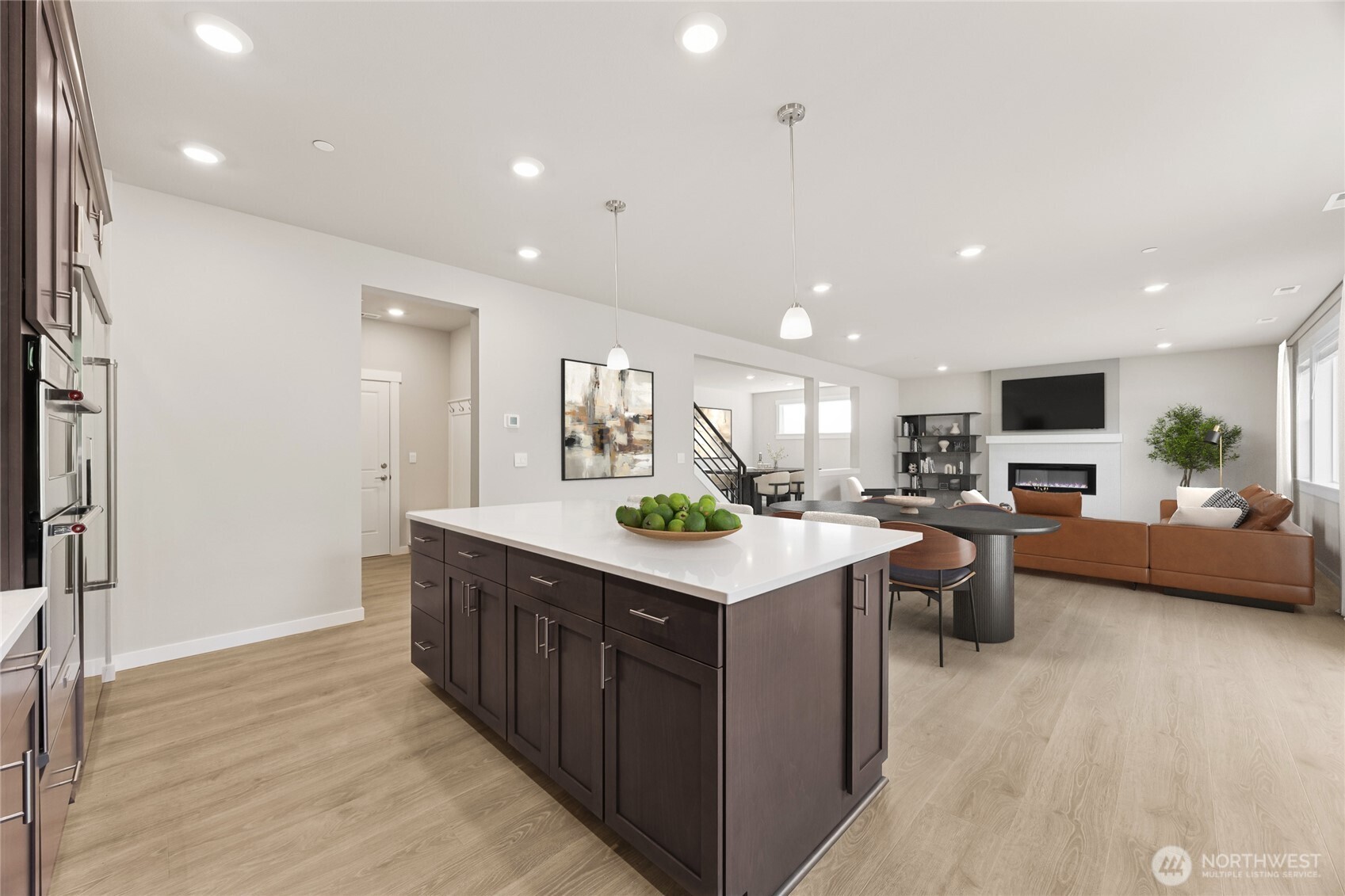 Kitchen opens to informal dining and great room - virtually staged.