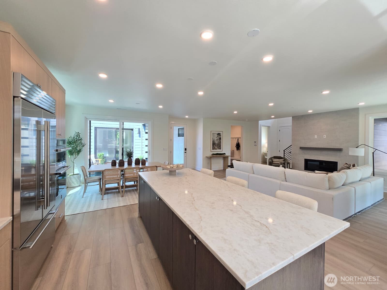 From kitchen looking towards great room and dining.  Notic Sub-Zero Fridge and JennAir Appliances