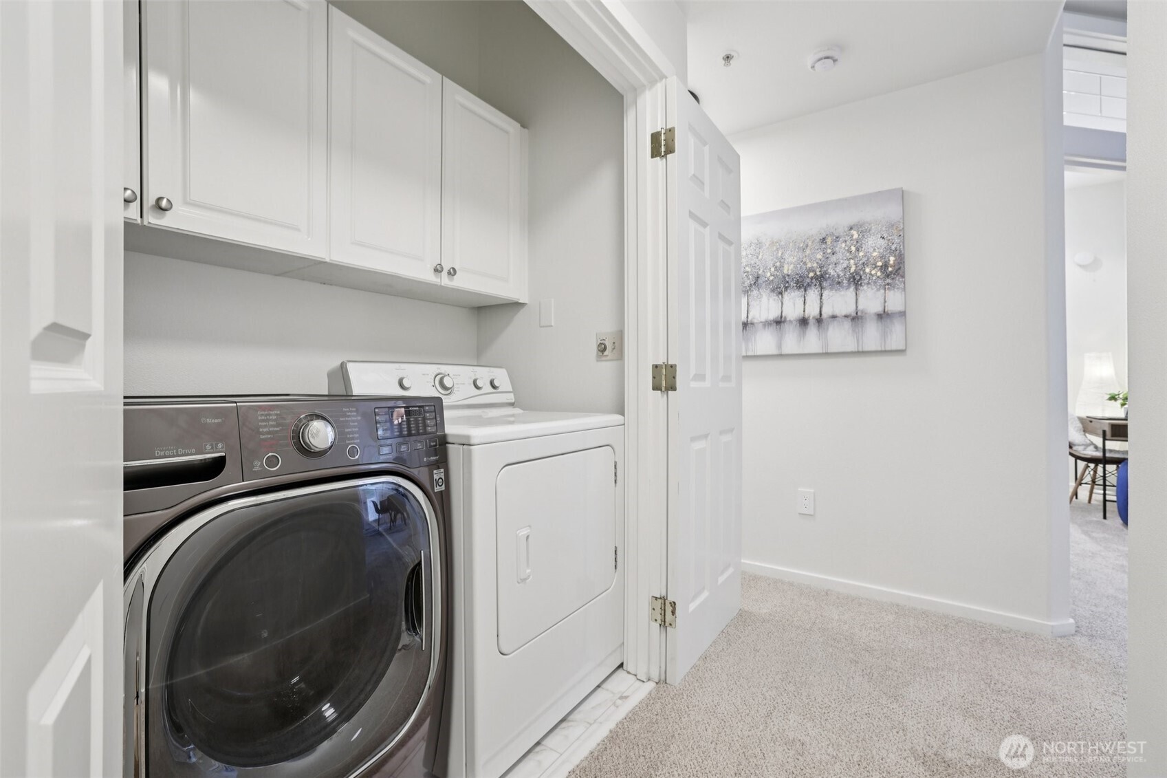Full Washer and Dryer with shelves.  New laminate tiled floor.