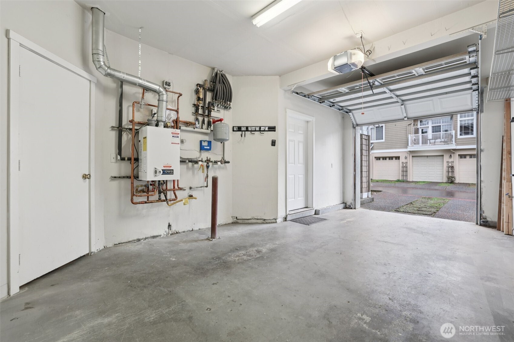 Large garage completely painted and ready for your vehicle!  EV Charger too.