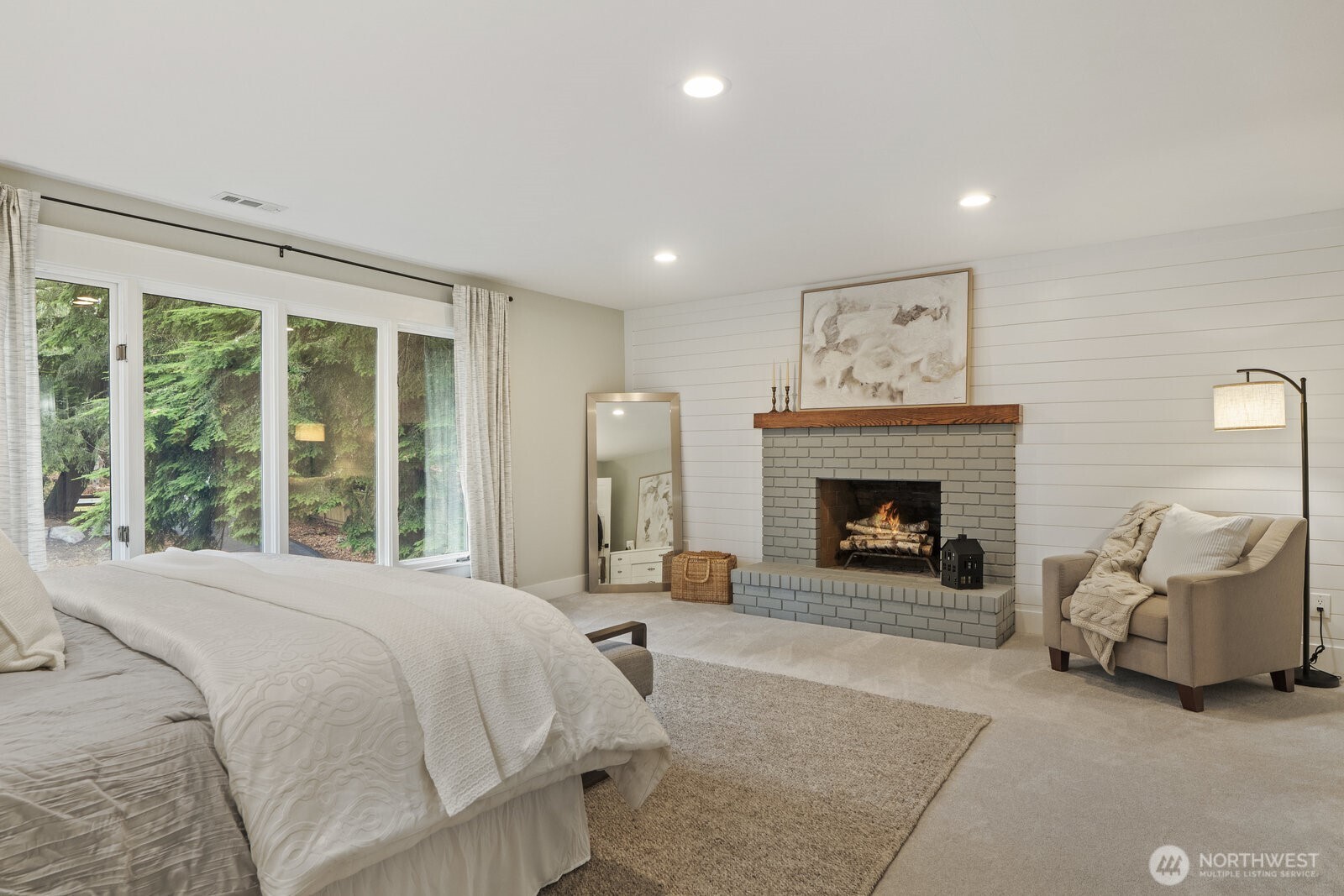Large primary bedroom with wood burning fireplace