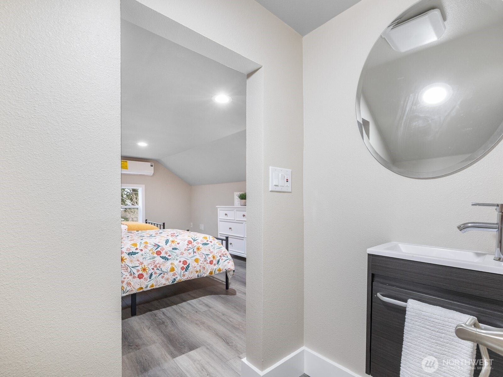 A view from the half bathroom looking into bedroom 3