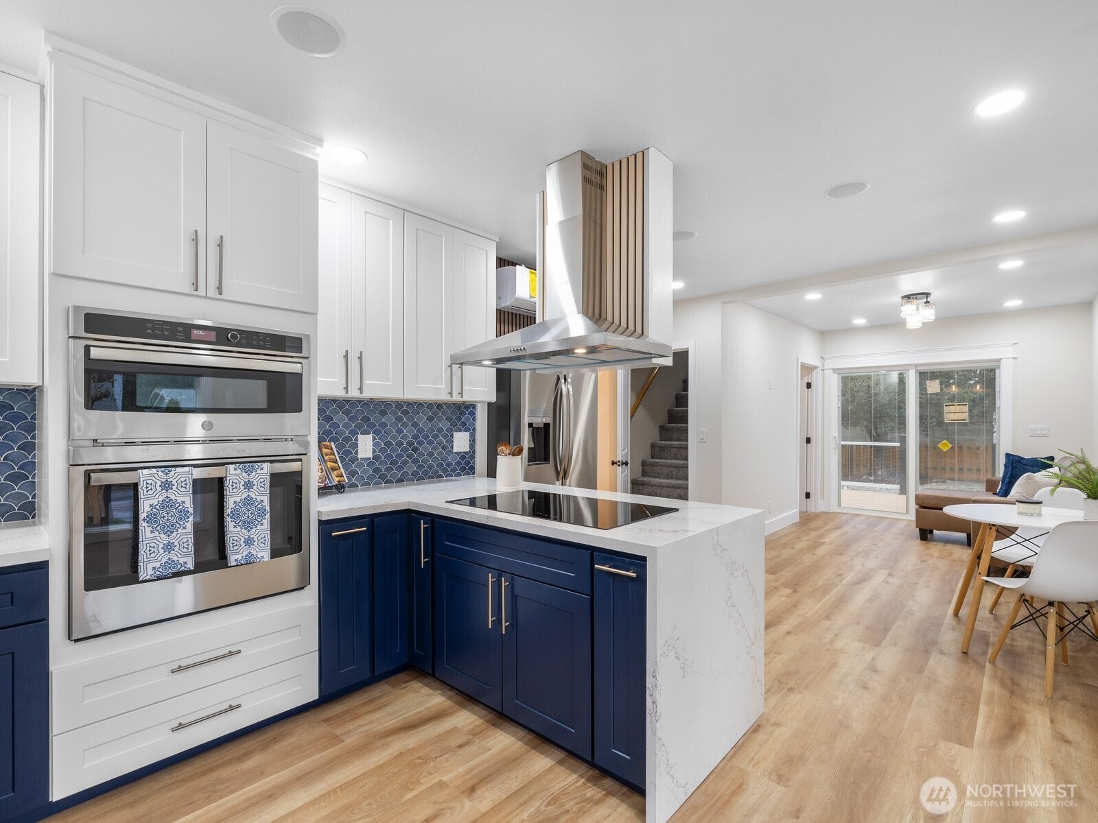 Two ovens, a stainless-steel hood, and Bosh cook top giving you everything you've hoped for in a kitchen
