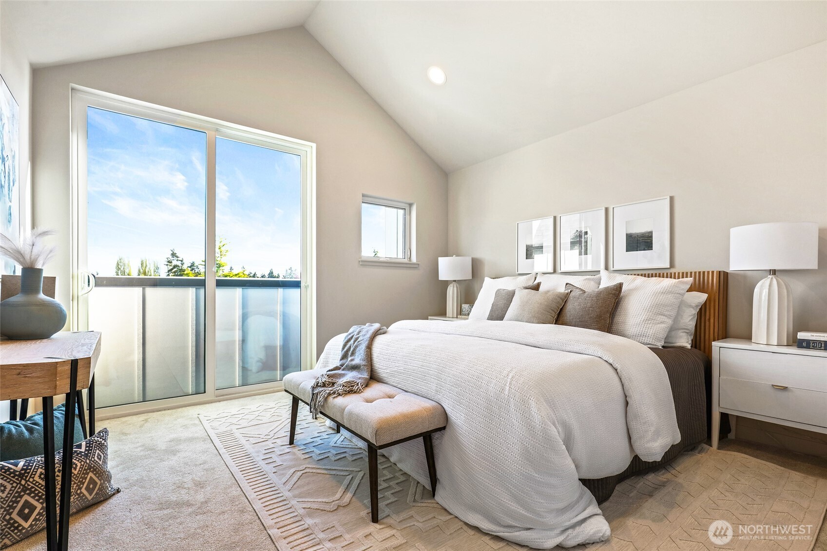 Photos of model home 9752 with similar finishes & floor plan. Your top-floor sanctuary awaits—vaulted ceilings, abundant light, and a private balcony that invites sunsets.
