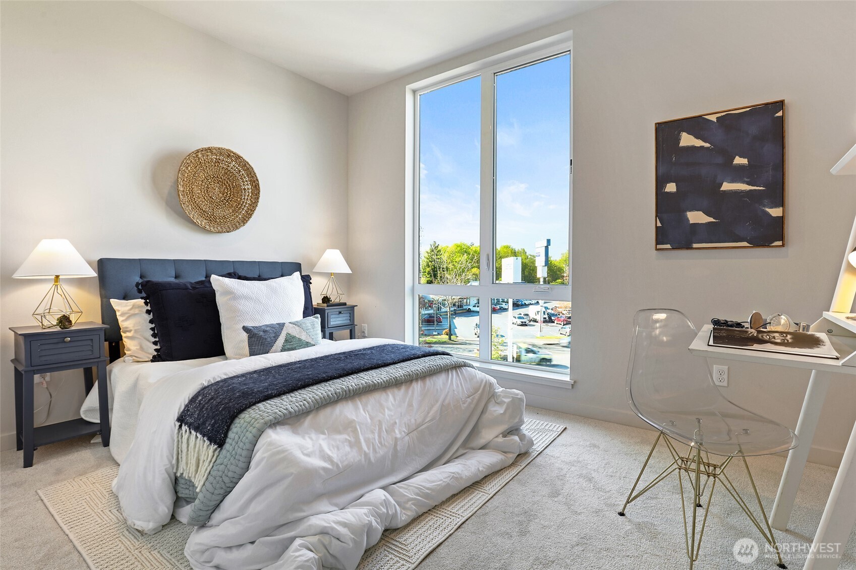 Photos of model home 9752 with similar finishes & floor plan. A sunlit bedroom designed for comfort, with oversized windows, plush carpeting, and space for a desk, is the perfect work-from-home or guest retreat.