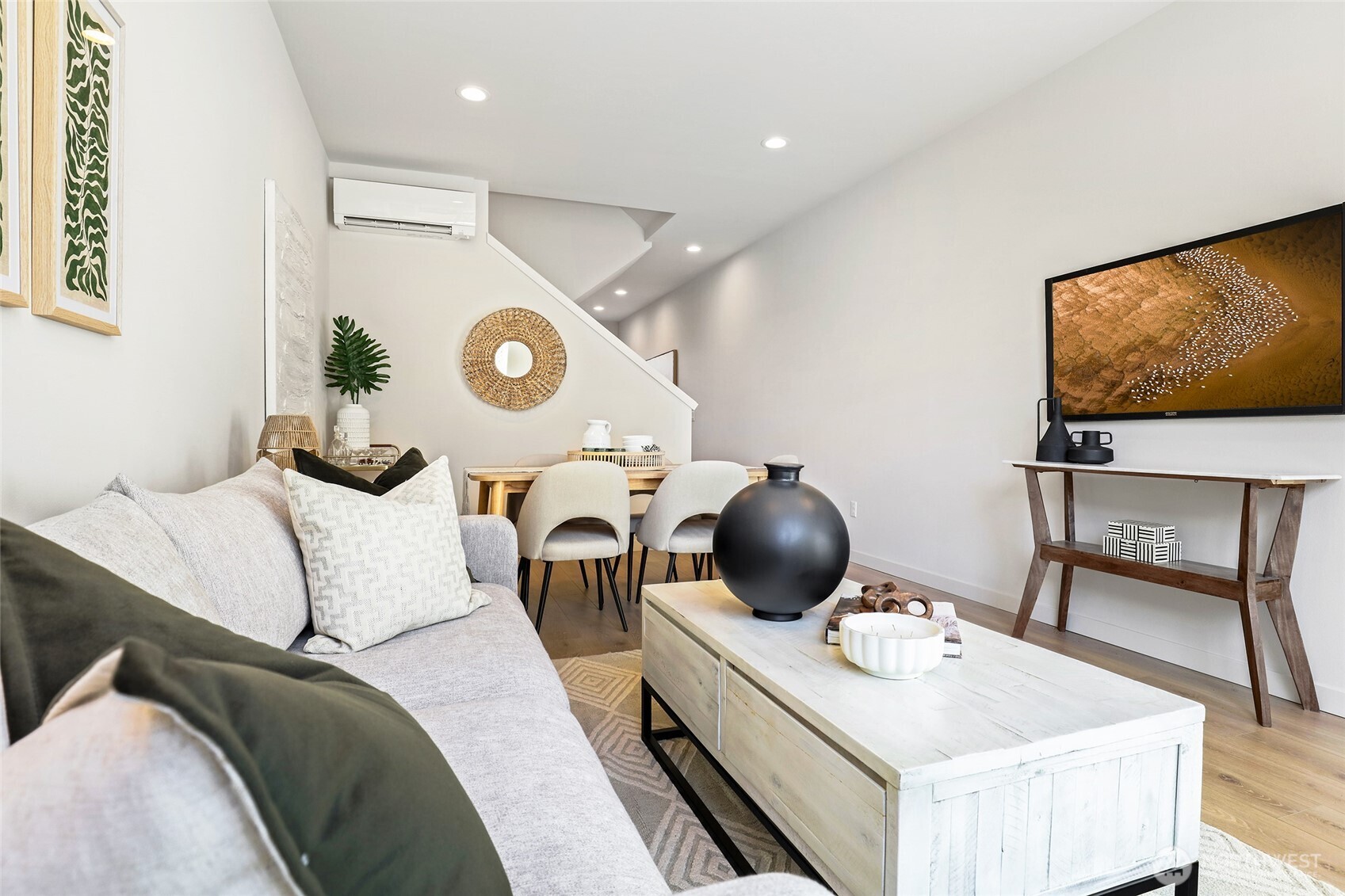 Photos of model home 9752 with similar finishes & floor plan. This living space maximizes design and livability from the TV wall to the dining nook.