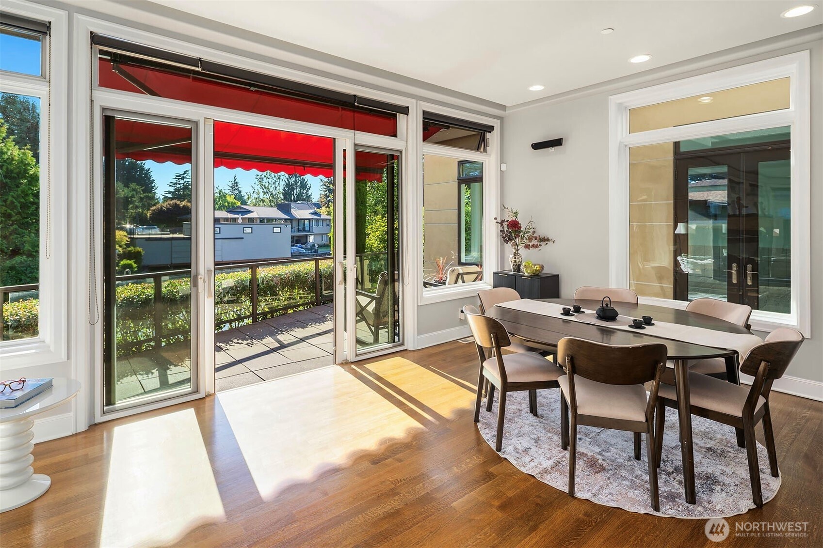Informal dining room opens to deck overlooking the canal. It could also be used as a second living room