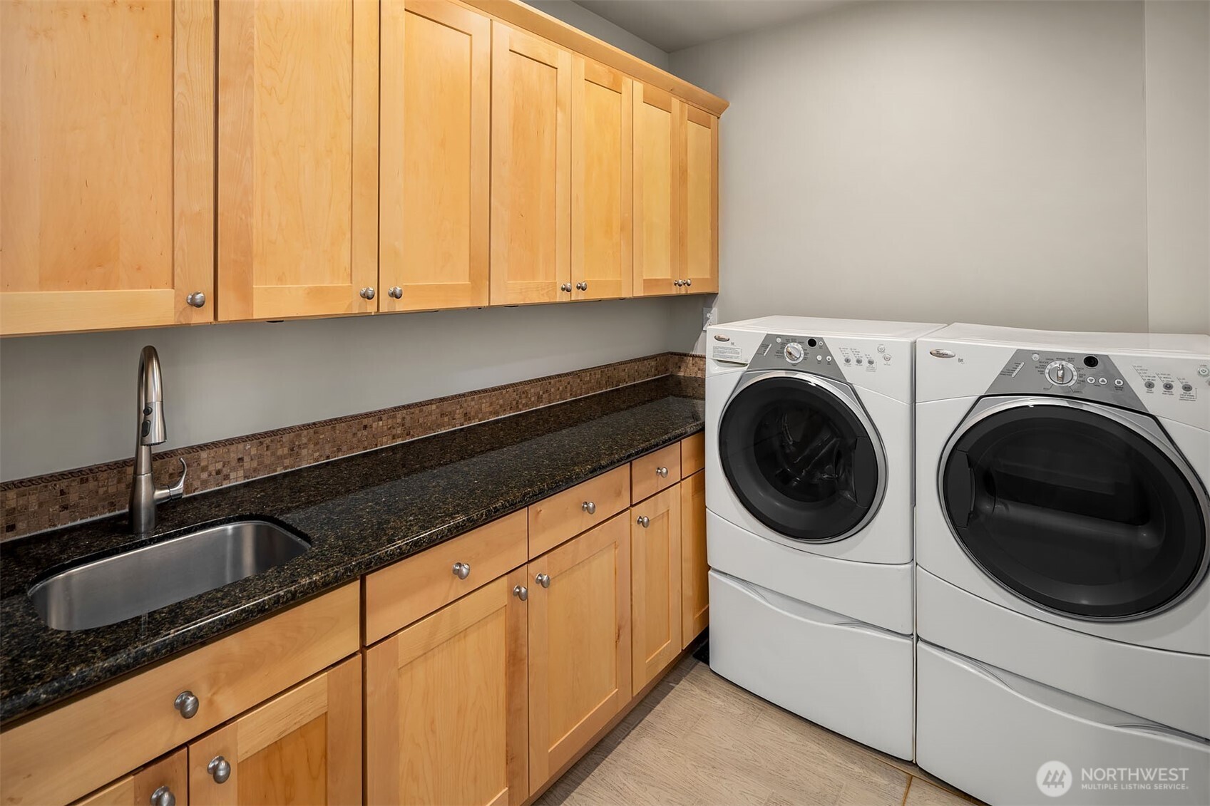 Upstairs laundry room. There is a second laundry room down by the pool.