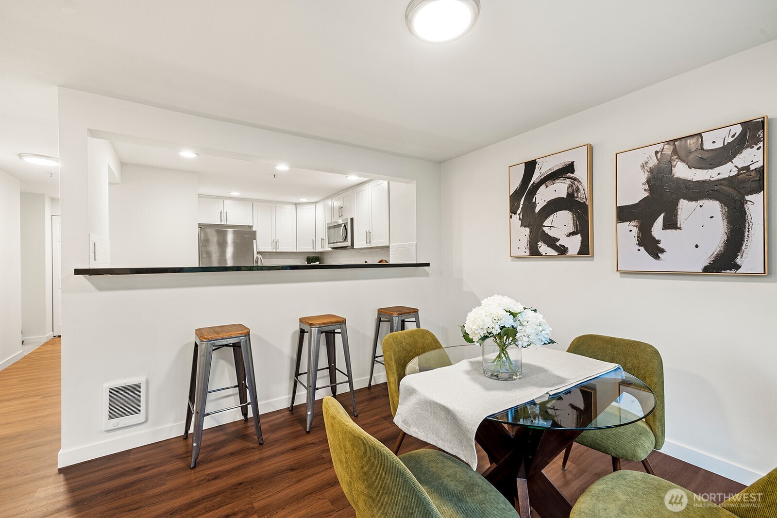 Spacious dining area with eat-in bar to kitchen